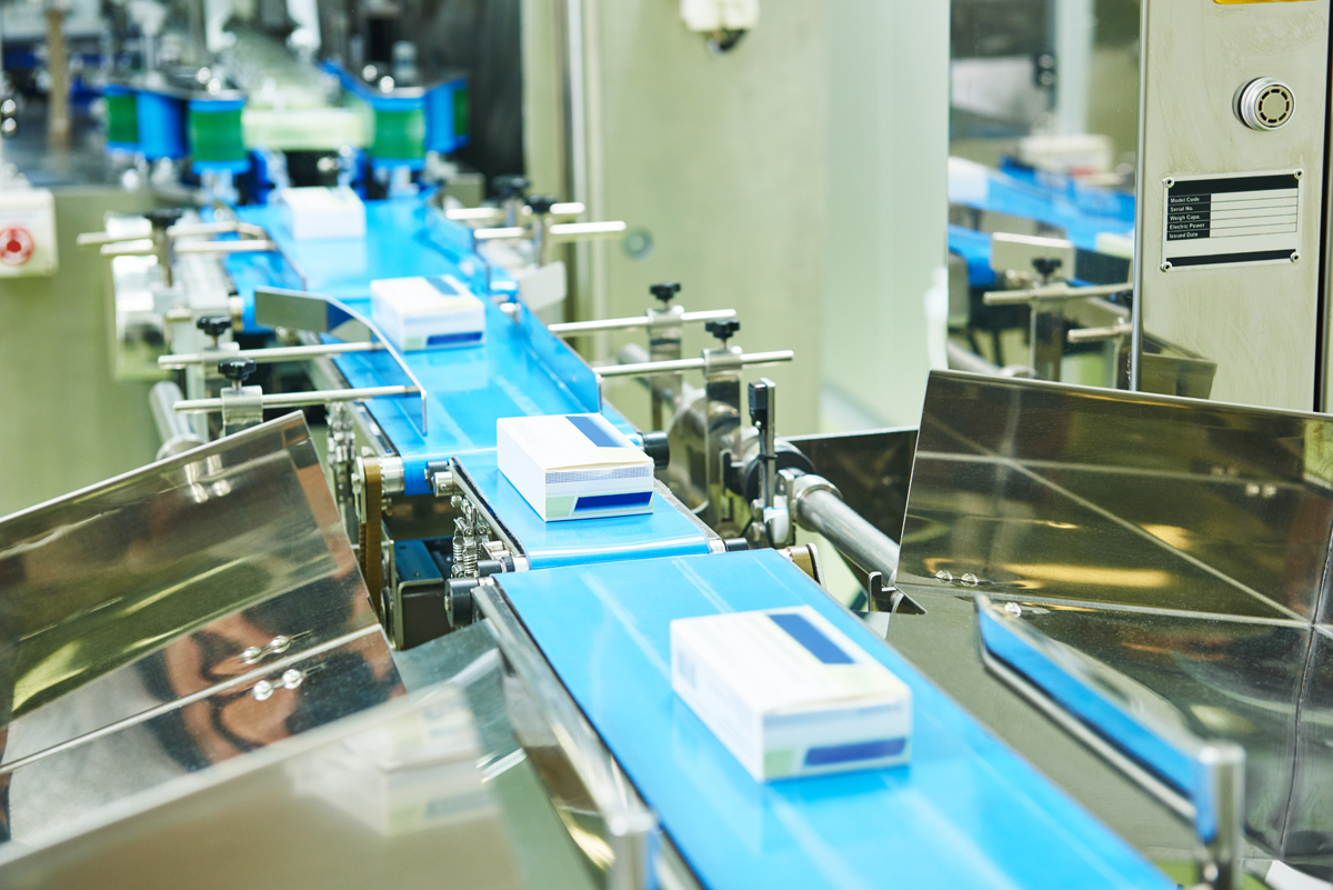 Serialized boxes of medicine on a manufacturing line in a pharmaceutical production facility